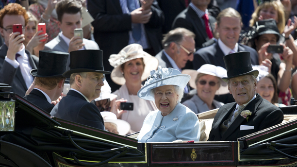 Queen Elizabeth II, center, with Prince Philip, right, Prince Andrew, second right and Prince Harry, arrive by carriage, on the first day of the Royal Ascot. (AP Photo/Alastair Grant)