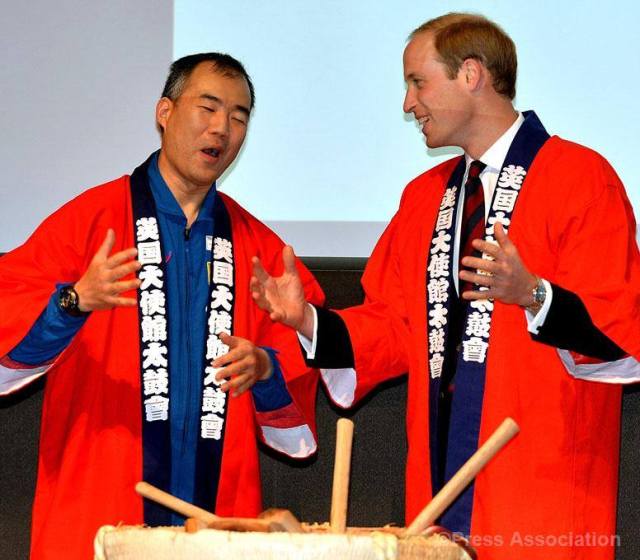 The Duke of Cambridge laughs with Astronaut Soichi Noguchi as he is clothed in a Japanese Happi coat before a Saki breaking barrel ritual. His Royal Highness was attending the Innovation is GREAT conference in Tokyo, promoting trade between the UK and Japan, 27 February 2015.