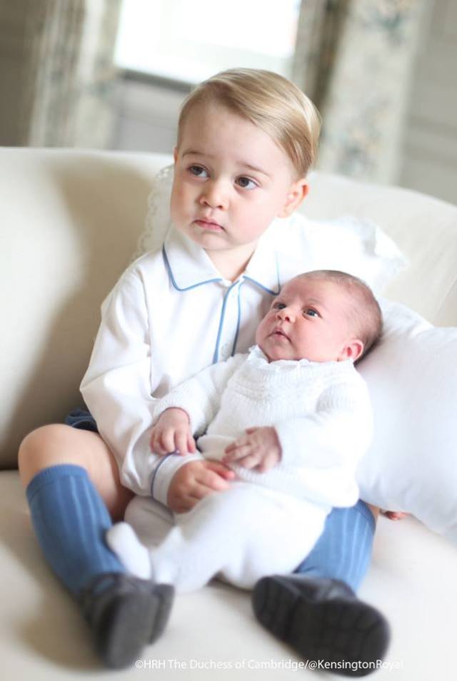 Like this mummy? Prince George holds his newborn baby sister.